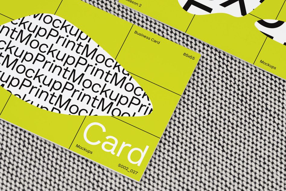 High-angle view of a yellow business card mockup with typographic design on a textured background, ideal for branding presentations.