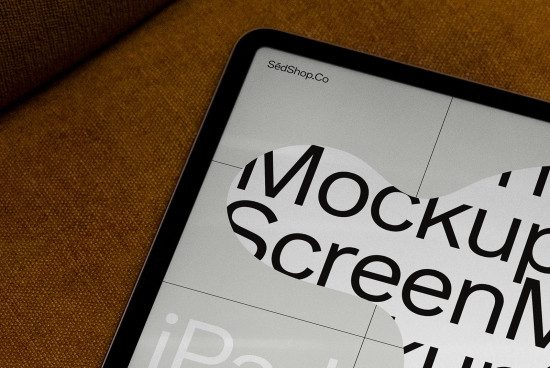 Tablet screen mockup on textured background displaying design website interface, ideal for presenting digital designs and templates.
