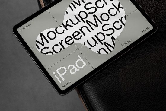 iPad digital mockup on leather surface for design presentation, showcasing screen and partial back view ideal for app and web design.