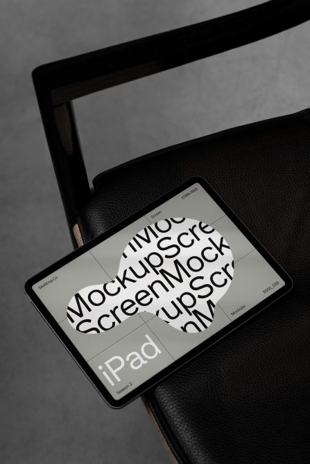 Modern iPad mockup on black chair for digital asset design, showcasing sleek device for template presentation, ideal for designers.