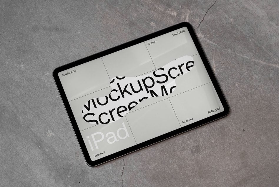 iPad mockup shot from above on textured ground surface