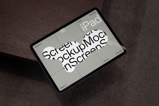 iPad screen mockup on wooden surface for digital asset design demonstrating usability, ideal for showcasing app interfaces to clients.