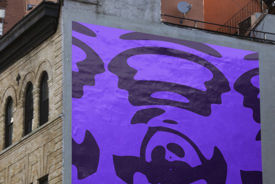 Urban wall mockup featuring a vibrant purple abstract graphic design, ideal for presenting street art or mural designs to clients.
