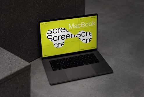 Laptop mockup on concrete steps displaying bright screen, perfect for designers showcasing web and user interface designs.