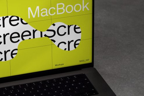 Close-up view of laptop screen mockup with vibrant yellow wrap design, ideal for presenting digital graphics and branding.