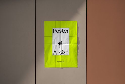 Bright yellow poster mockup A-size on a wall showcasing font and graphic design elements, ideal resource for creative designers.