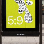 Urban billboard mockup with bright yellow poster display in a street setting, featuring large text and design space, ideal for advertising presentations.