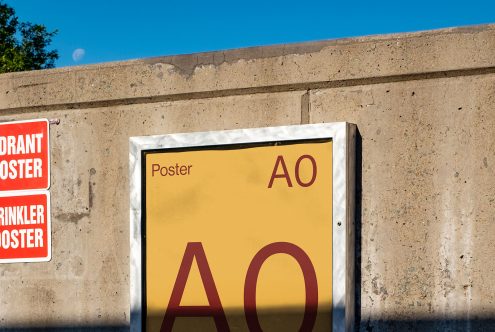 Outdoor poster mockup on concrete wall in daylight for presentation of graphic design, advertising fonts, and urban templates.