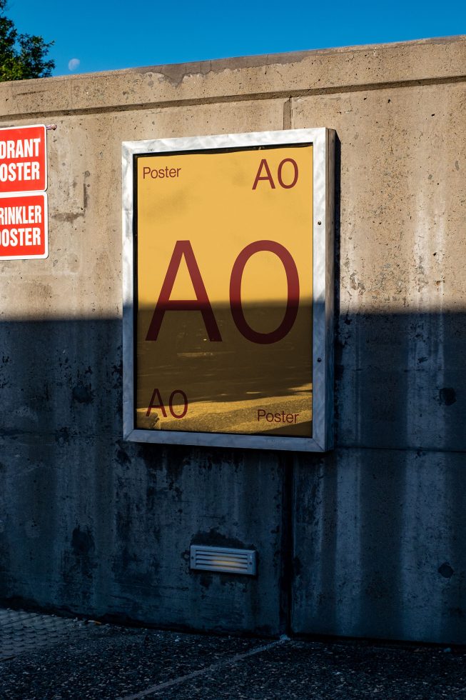 Outdoor poster mockup on a concrete wall at sunset for advertising design presentation, high-resolution digital asset for graphic designers.