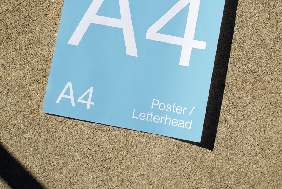 A4 poster mockup on a concrete background with clear text and shadow, ideal for designers presentation, stationery design preview.