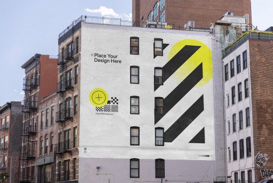 Urban building wall with a large customizable mockup advertisement, bold geometric shapes, editable design space, ideal for large format graphics.