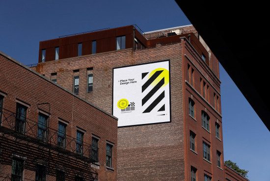 Urban billboard mockup on brick building exterior for outdoor advertising design display, clear blue sky, template.