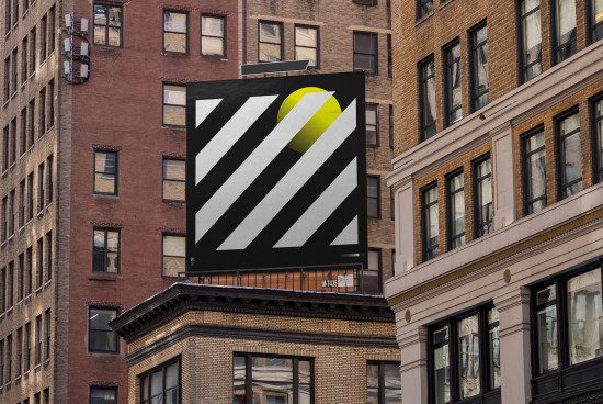 Billboard mockup on urban building with geometric design and a splash of yellow, perfect for presenting advertising graphics in a city context.