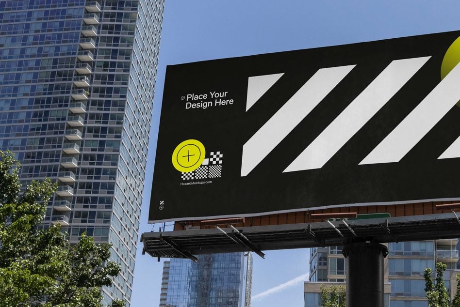 Urban billboard with diagonal stripe pattern, yellow circle, tall buildings in background