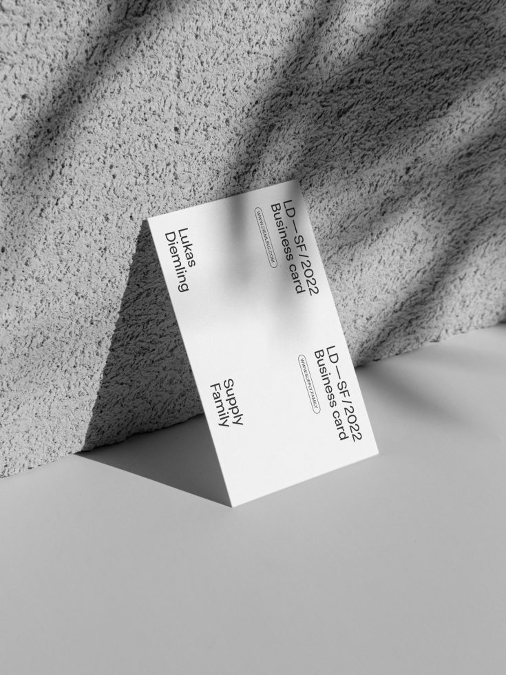 Elegant business card mockup with shadow, presenting a modern design for showcasing branding projects on a textured background, ideal for designers.