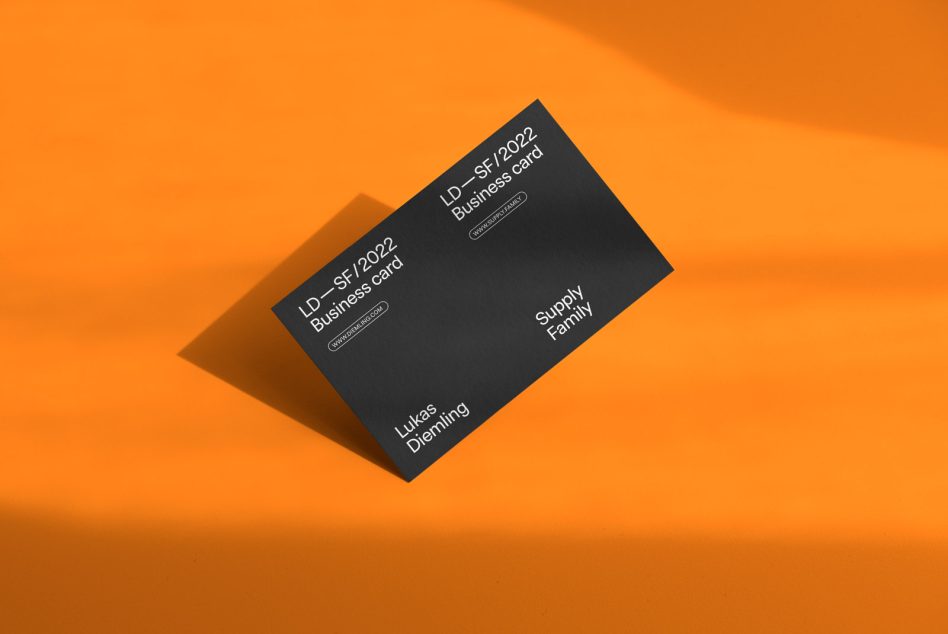 Elegant black business card mockup on orange background, showcasing modern typography and design layout for creative professionals.