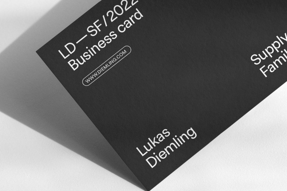 Elegant black business card mockup with clean design and white typography angle view suitable for graphic designers and branding presentations.