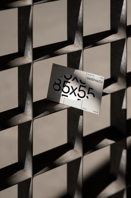 85x55 business card mockup tilted on geometric concrete background