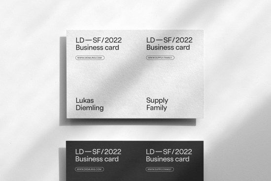Business card mockup with minimal design on a textured surface, showcasing front and back design options for professional branding.