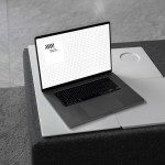 Laptop mockup on a modern desk for showcasing website designs, suitable for design templates, with grid screen, minimalist style.