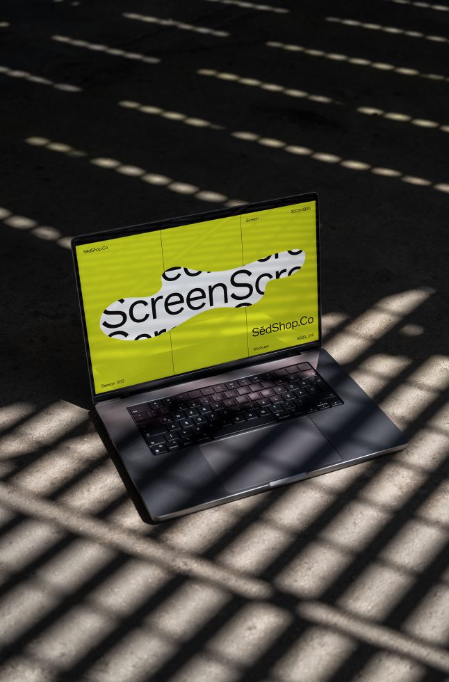 Laptop with bright screen mockup in sunlight and shadow pattern, ideal for presenting digital designs and website templates for designers.