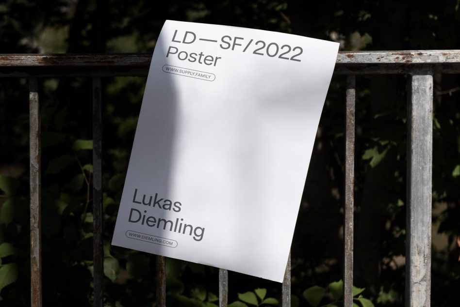 Blank poster mockup with minimal text on a metal fence, outdoor setting, natural light, ideal for designers to display their work.