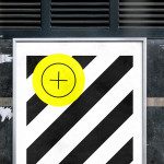Urban poster mockup with bold graphic design, diagonal stripes and bright yellow circle, against textured city wall background for designers.
