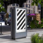 Urban street kiosk mockup with diagonal stripe design, set against a lively city backdrop with pedestrians and storefronts, perfect for advertising presentations.