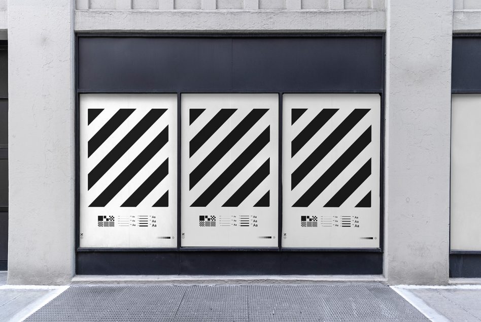 Street-level store facade mockup with striped design graphics on window displays, modern urban shop exterior template for designers.