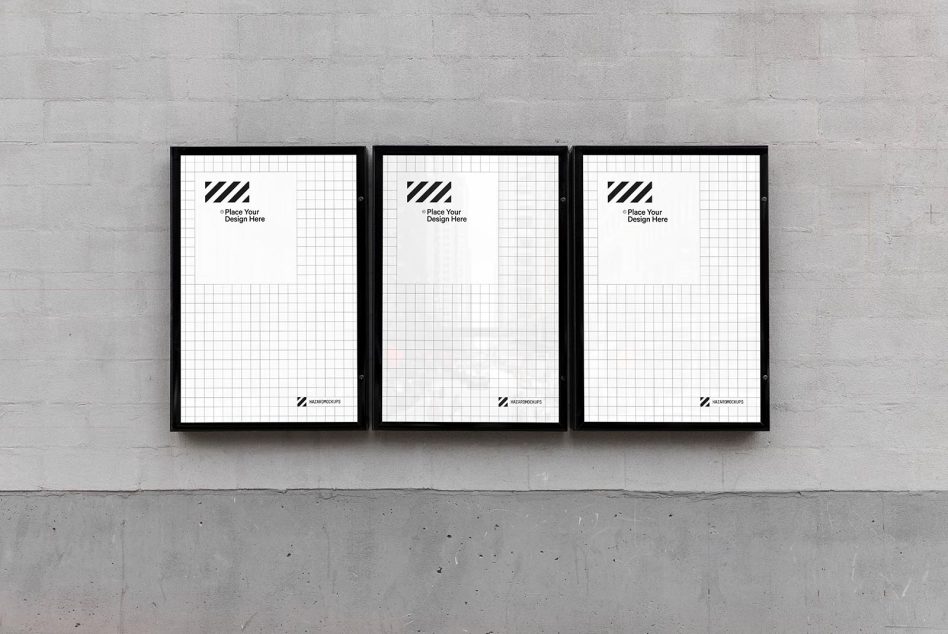 Triple poster mockups on a grey brick wall for showcasing designs, ideal for creatives, display in portfolio, modern and minimalist.