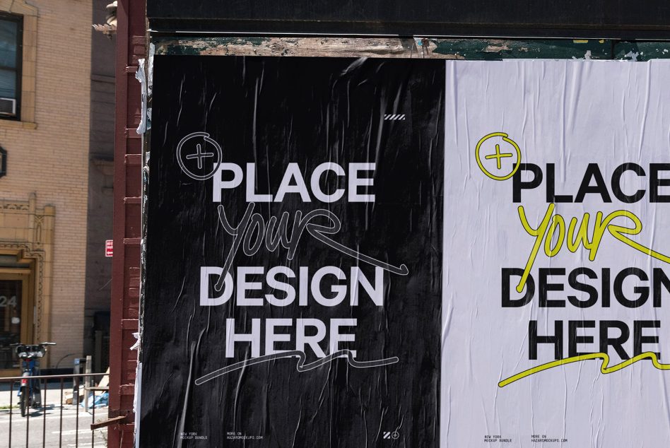 Weathered storefront window with three large posters, black, white, yellow color blocks
