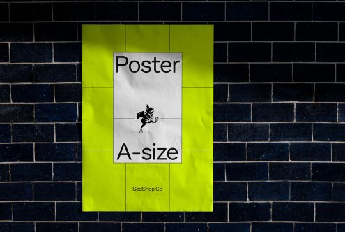 Mockup of a neon green A-size poster hanging on a dark brick wall, showcasing design space for graphics and branding materials.