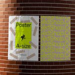 Mockup of a yellow A-size poster with a frog graphic, taped to a curved brick wall, showcasing poster design and presentation for designers.