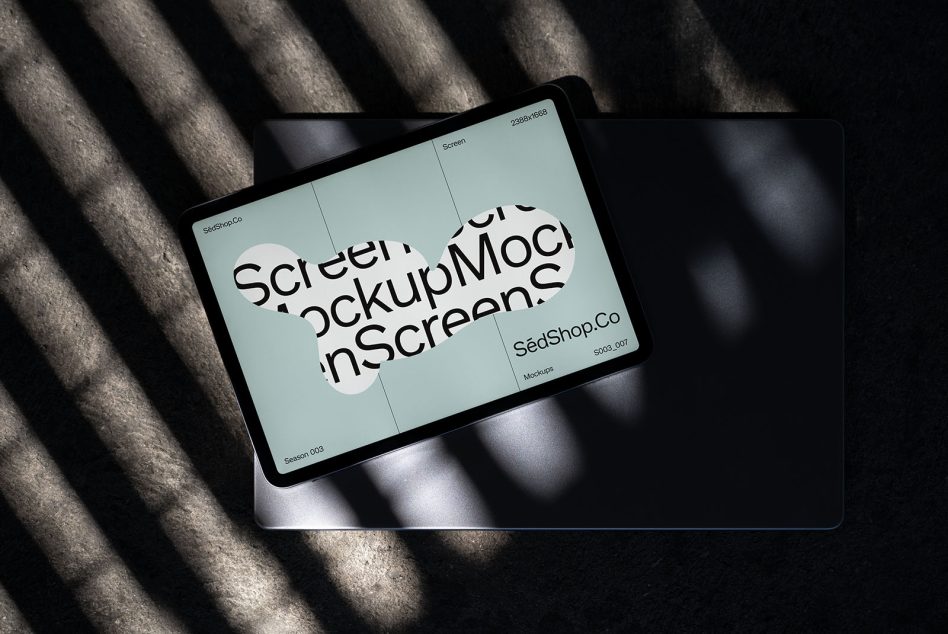 Pale blue tablet mockup angled on fabric with strong directional shadows