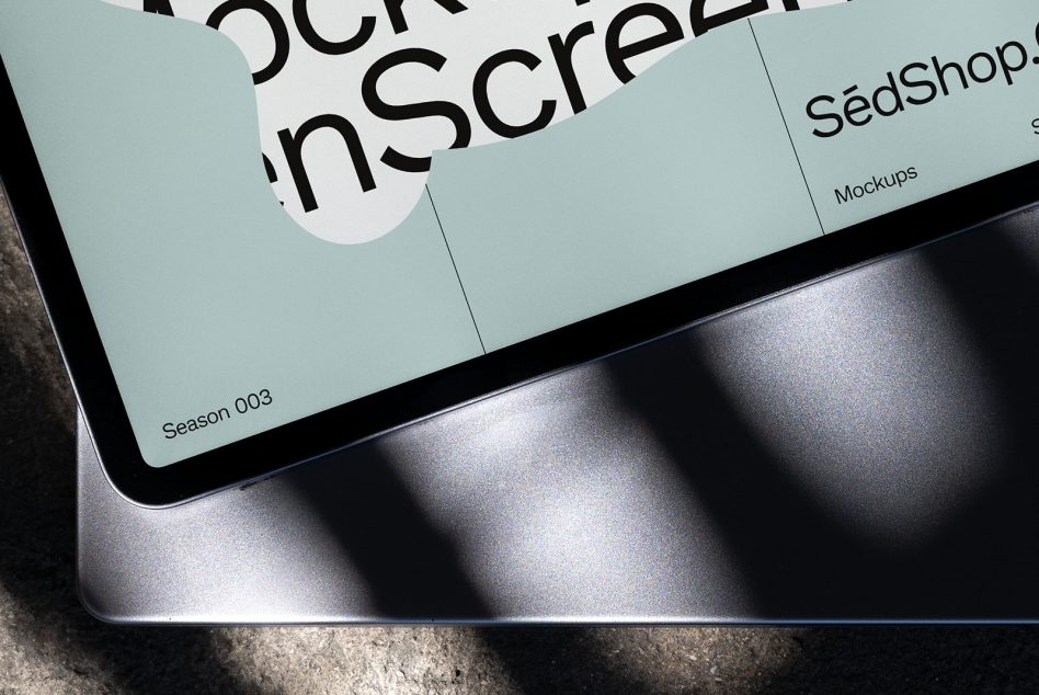 Light blue tablet mockup with curved text element on metal surface