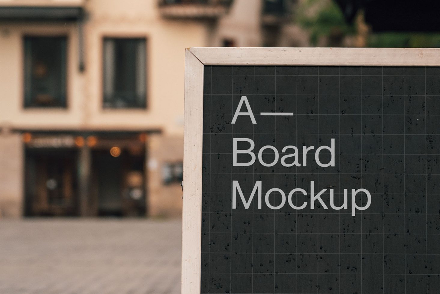 Urban setting A-board mockup displayed on sidewalk with clear text space for design and advertisement presentations.