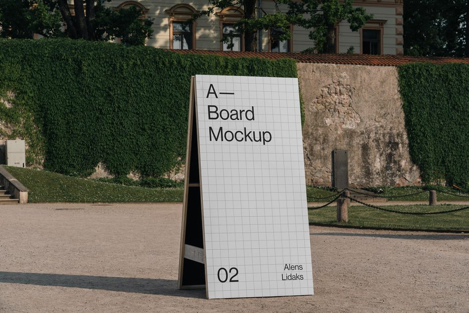 Outdoor A-board advertising mockup in an urban park setting, perfect for designers to showcase signage or marketing graphics.