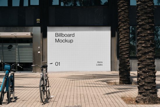 Outdoor billboard mockup in urban setting with clear sky, bicycles in foreground, suitable for advertising design presentations.