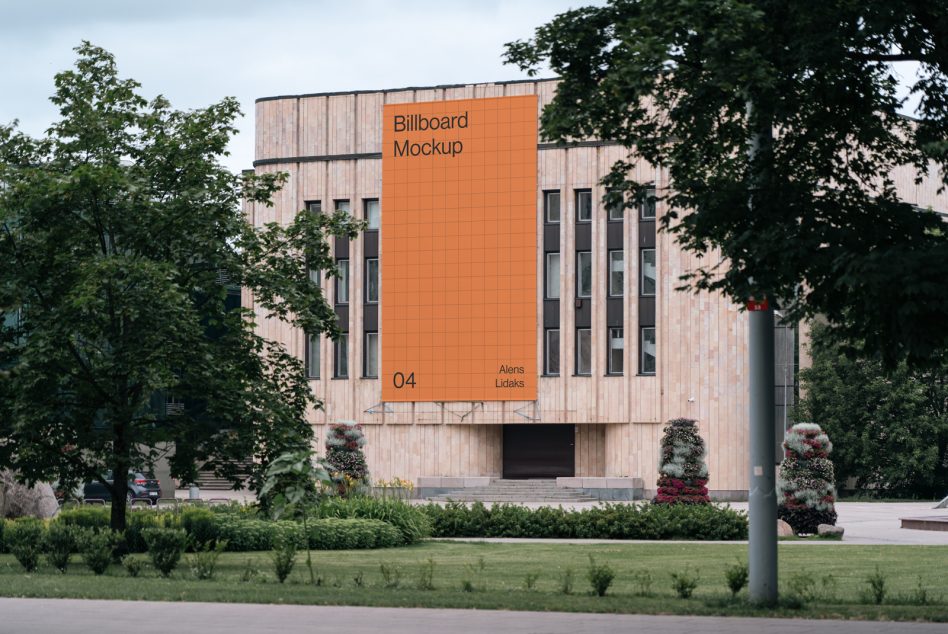 Urban billboard mockup on modern building exterior surrounded by trees, perfect for advertising design presentations for designers.