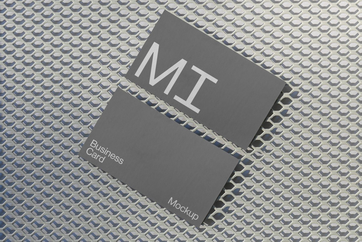 Business card mockup on metal grid background, elegant design presentation, graphic design asset for professional branding.