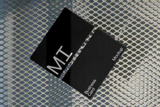 Business card mockup on metallic mesh surface, diagonal placement, modern design, clean branding presentation, digital asset for designers.