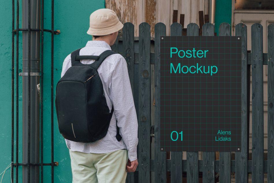 Person in bucket hat and backpack passing by a realistic outdoor poster mockup on a wooden fence, perfect for design presentations.