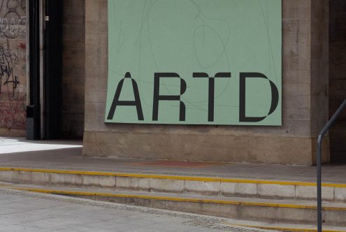 Urban poster mockup on street wall with bold ARTD text, ideal for designers looking to showcase street-level advertising graphics.