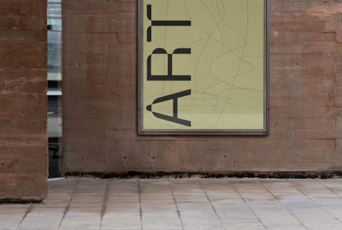 Outdoor poster mockup on a brick wall background, showcasing city street advertising with modern font design, ideal for graphic presentations.