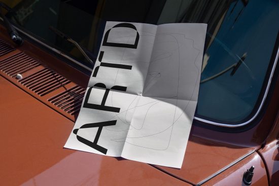Car windshield mockup with paper notes for font presentation, realistic vehicle branding demo in sunlight, design showcase.