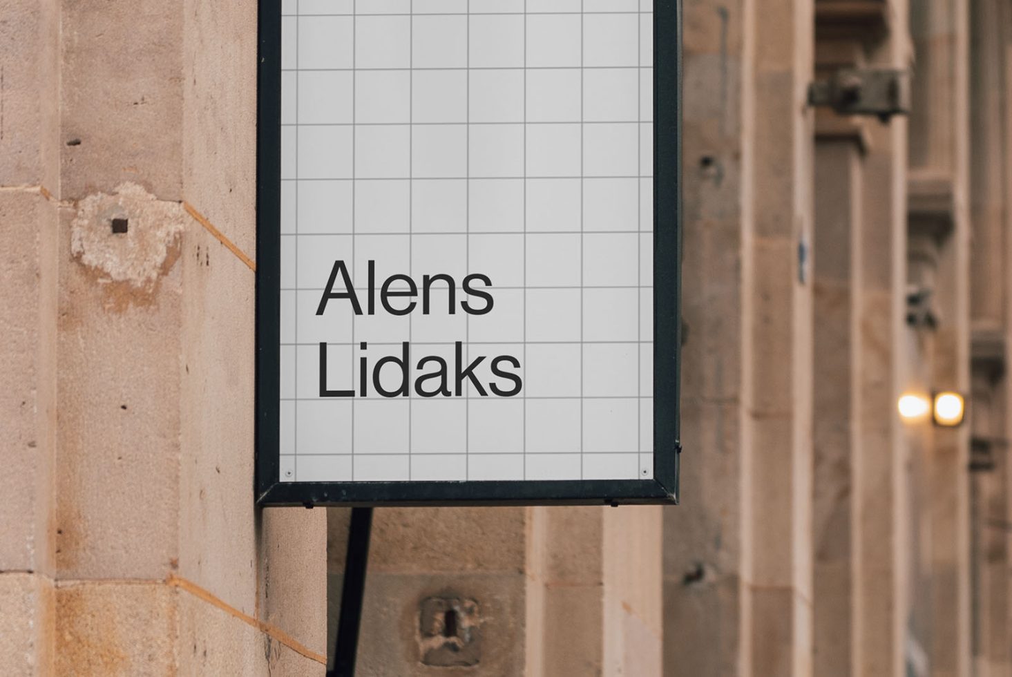 Outdoor signboard mockup with grid pattern and bold sans-serif font, ideal for branding presentations and storefront signage designs for designers.