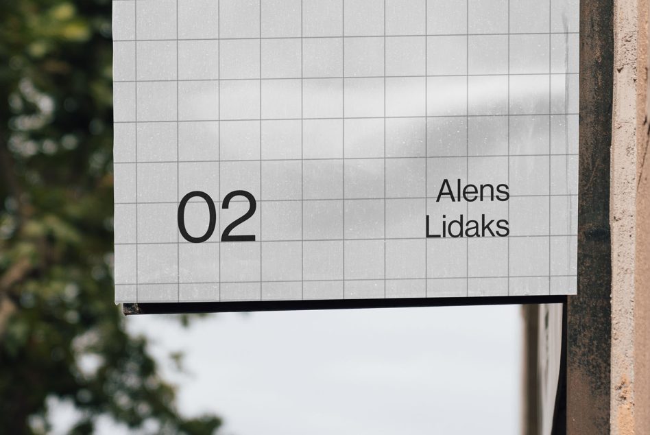 Hanging white sign mockup showing bottom portion with number, outdoor greenery