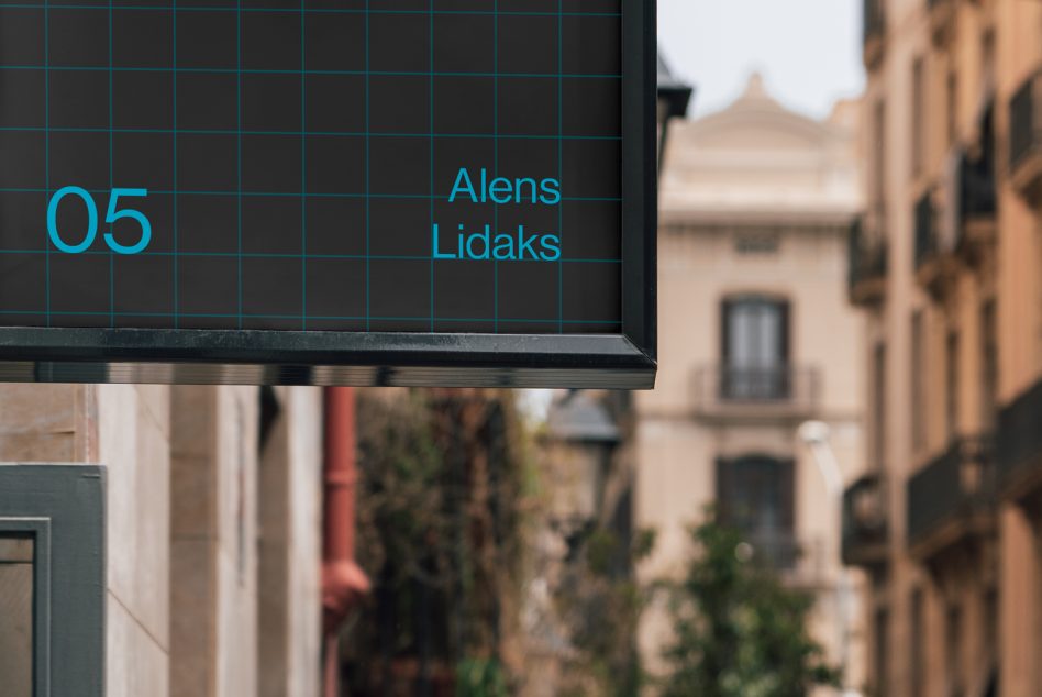 Urban billboard mockup with teal grid design and text overlay, city building background, clear for advertising, designers asset.