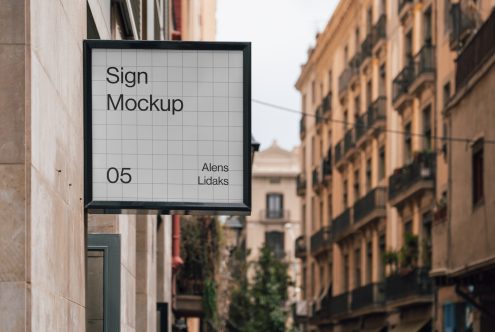 Outdoor sign mockup in urban setting perfect for displaying brand logos and advertising designs for designers' digital asset collections.