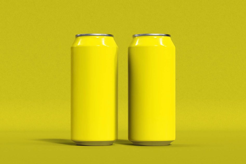 Two glossy yellow cans with silver rim on yellow ground, minimal shadow